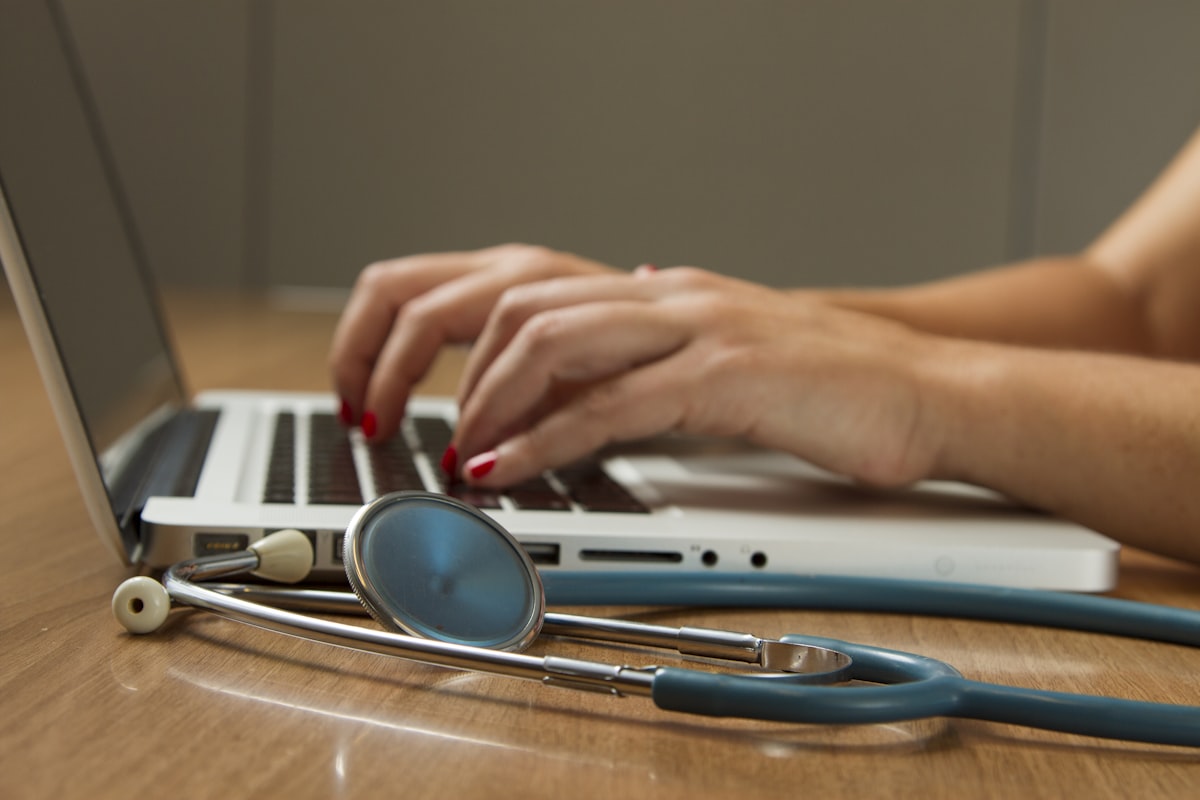 Senior patient consulting with physician reviewing medical coverage options and out-of-pocket costs