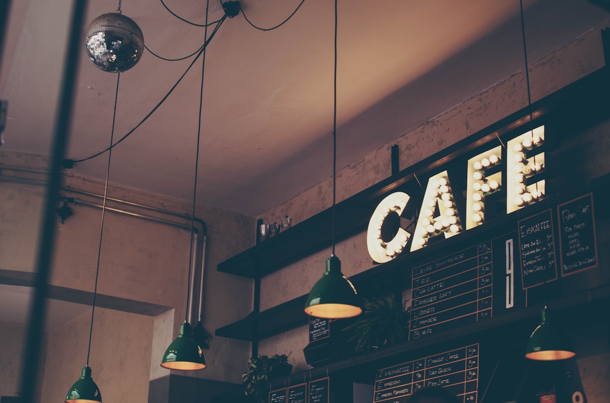 Commercial espresso machine and coffee beans representing cafe rewards