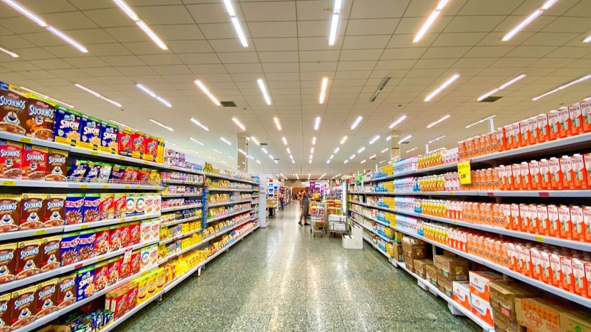 Clean grocery store pantry shelves with packaged cereal and baking goods